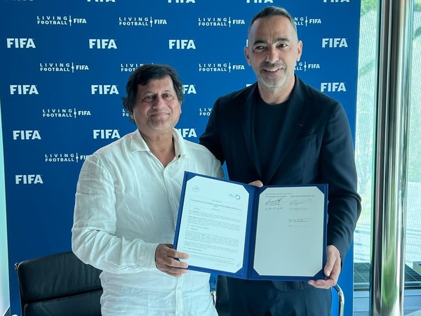 Dr. Achyuta Samanta, Founder of KISS exchanging MoU with Youri Djorkaeff, CEO of the FIFA Foundation
